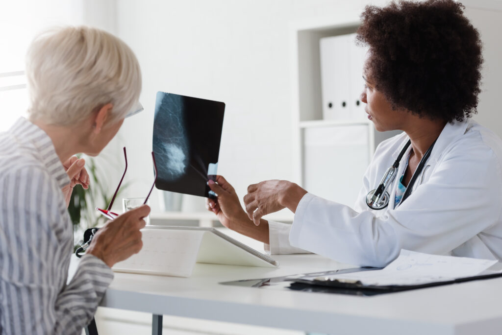 Patient consulting with an oncologist in a medical setting