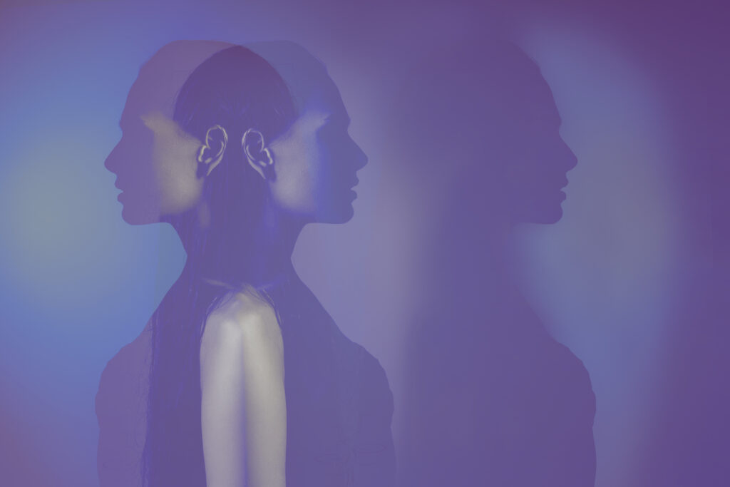 2 silhouettes of a female head. mental health concept